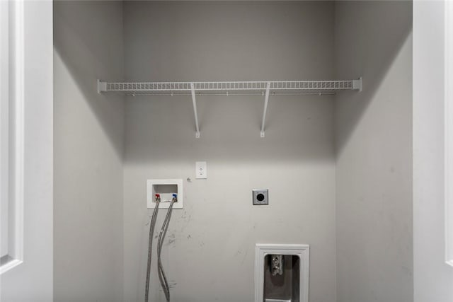 clothes washing area featuring hookup for an electric dryer and hookup for a washing machine