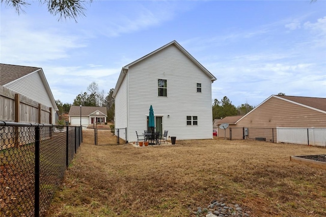 rear view of house with a lawn