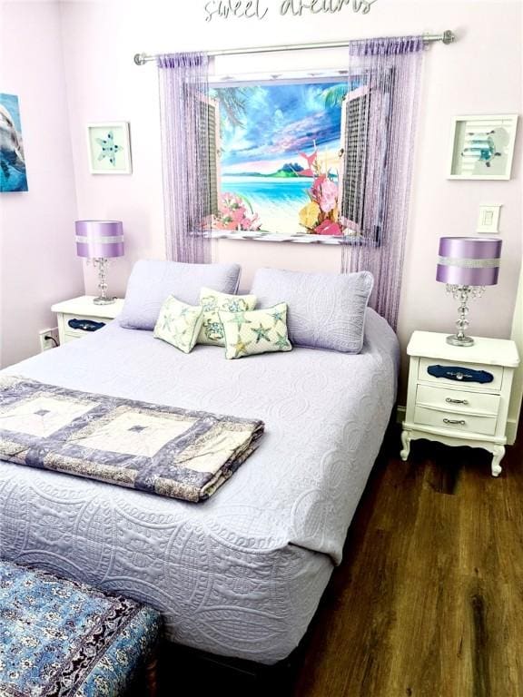 bedroom featuring dark wood-type flooring