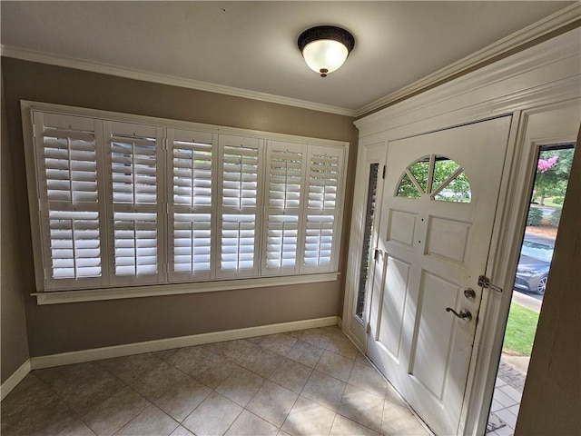 tiled entrance foyer with crown molding