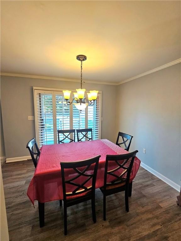 dining room featuring ornamental molding, dark hardwood / wood-style floors, and a chandelier