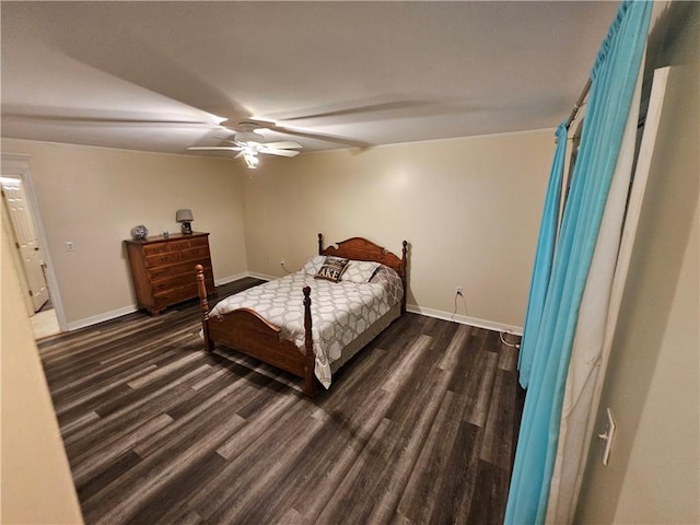 bedroom featuring dark wood-type flooring and ceiling fan