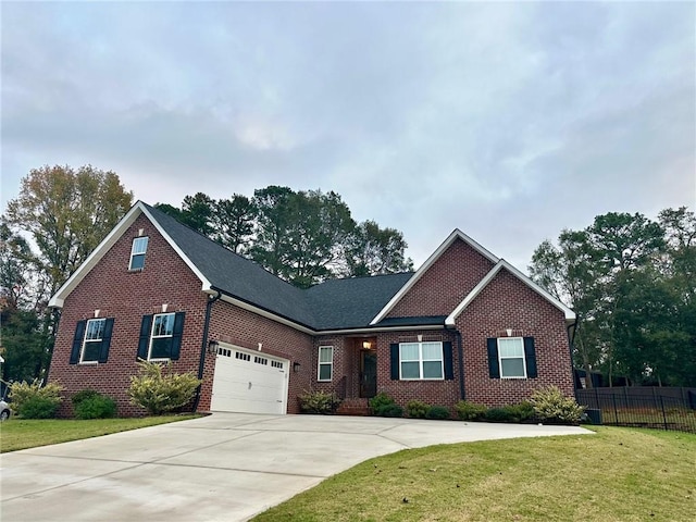 view of front of property with a garage and a front lawn