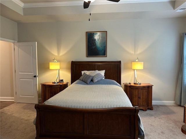 carpeted bedroom with ornamental molding