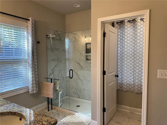 bathroom with vanity and an enclosed shower