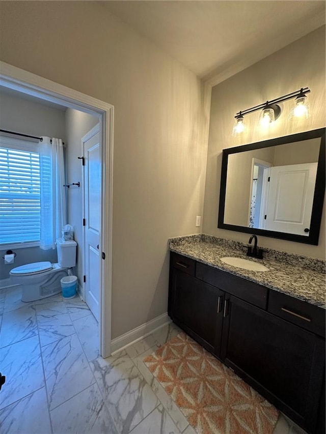 bathroom with vanity and toilet