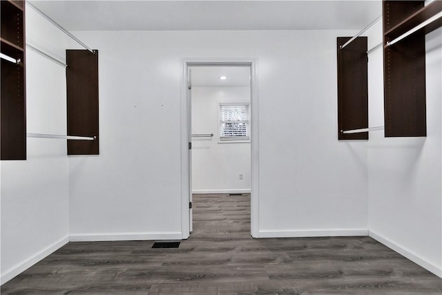 spare room with dark wood-type flooring