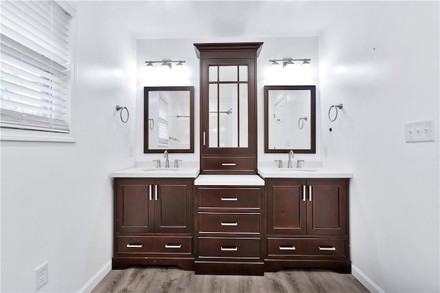 bathroom featuring vanity and hardwood / wood-style floors