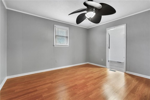 unfurnished room with ceiling fan, ornamental molding, and light hardwood / wood-style floors