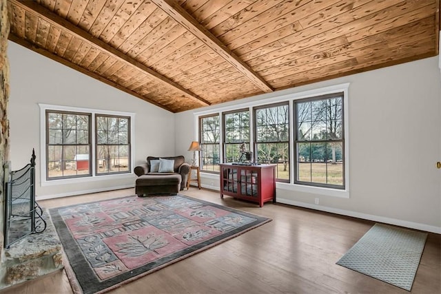 living area featuring hardwood / wood-style flooring, lofted ceiling, and wooden ceiling