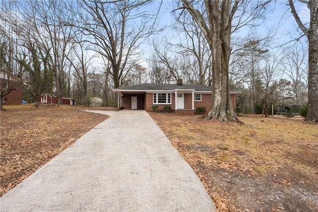 ranch-style home with a carport