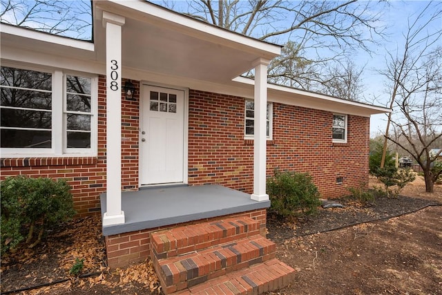 doorway to property with a porch