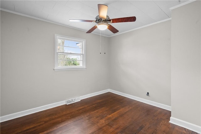 empty room featuring crown molding, ceiling fan, and dark hardwood / wood-style floors