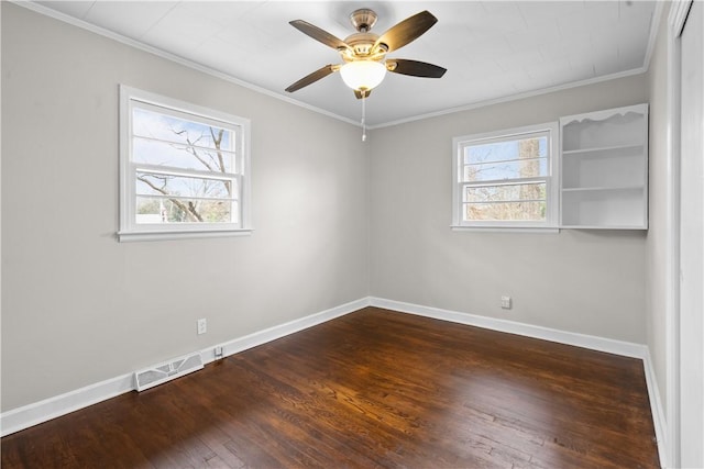 unfurnished room featuring crown molding, dark wood-type flooring, and ceiling fan