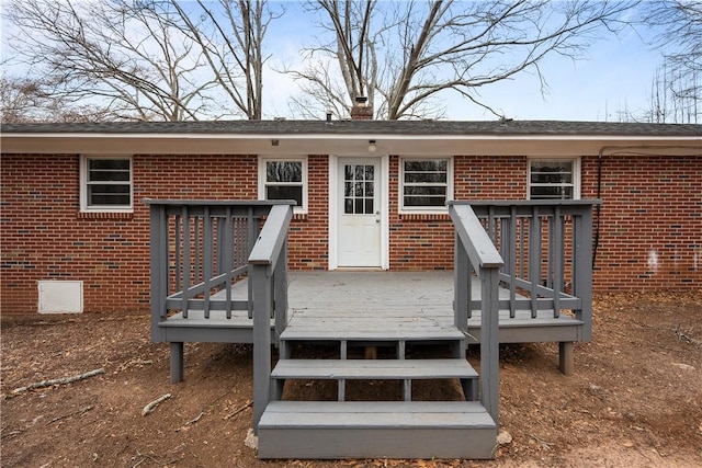 entrance to property with a deck