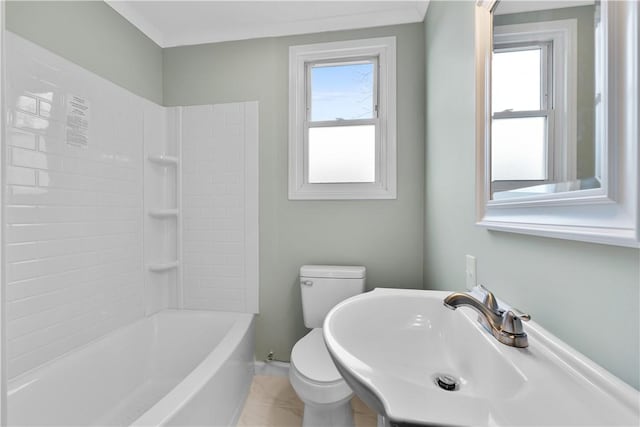 full bathroom with sink, plenty of natural light, tub / shower combination, and toilet