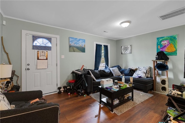 living room with ornamental molding and dark hardwood / wood-style flooring