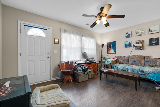 living room with wood-type flooring and ceiling fan