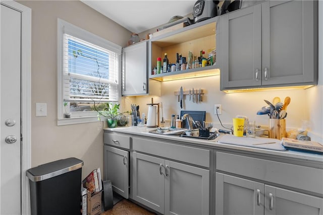 bar with sink and gray cabinets