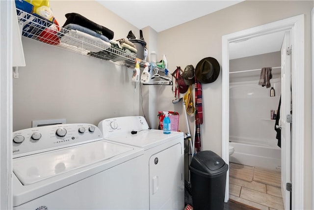 laundry area with separate washer and dryer