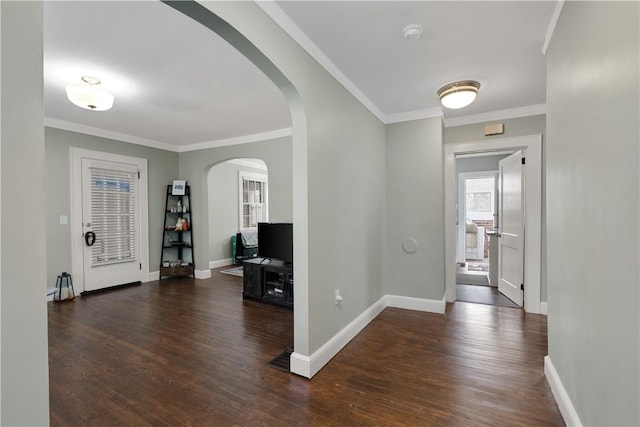 entrance foyer featuring crown molding and dark hardwood / wood-style floors