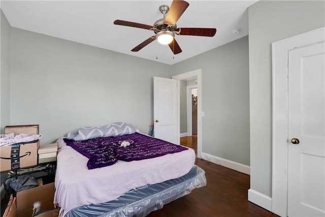 bedroom featuring ceiling fan and dark hardwood / wood-style flooring