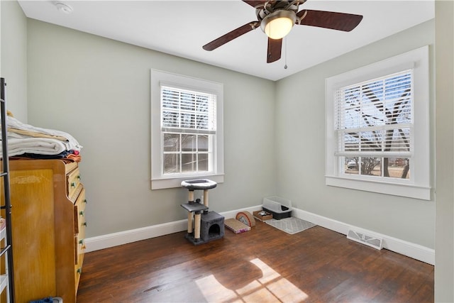 spare room featuring dark hardwood / wood-style flooring and ceiling fan