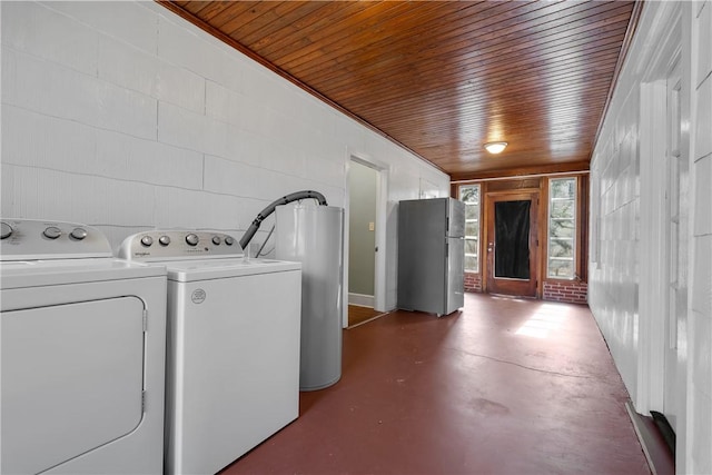 laundry area with washing machine and clothes dryer and wooden ceiling