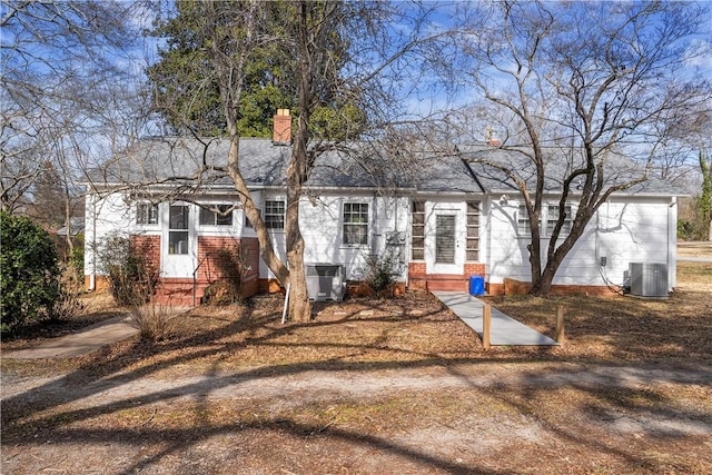 ranch-style house with central air condition unit