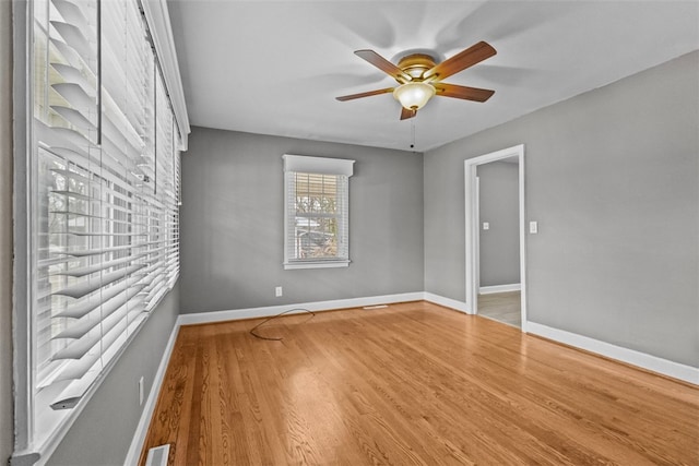 empty room featuring ceiling fan and wood-type flooring