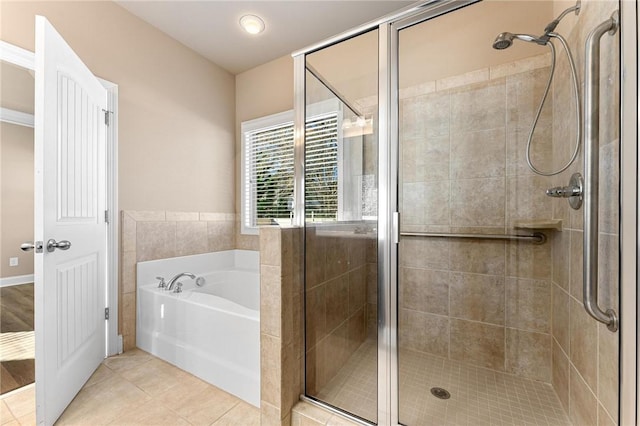 bathroom featuring tile patterned flooring and plus walk in shower