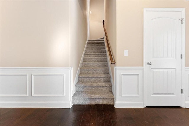 stairway featuring wood-type flooring