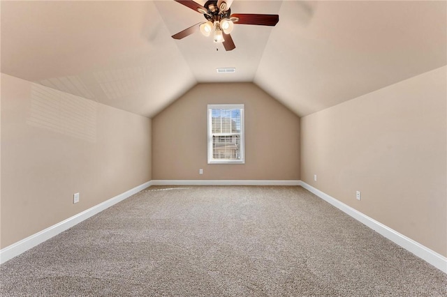 bonus room with ceiling fan, carpet flooring, and vaulted ceiling