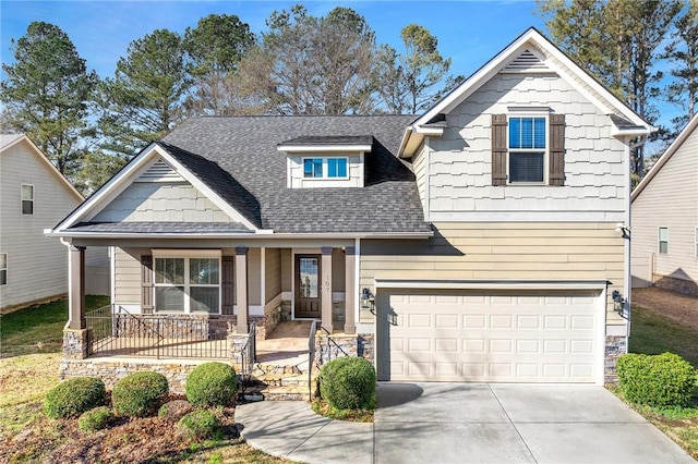 craftsman house with a porch and a garage