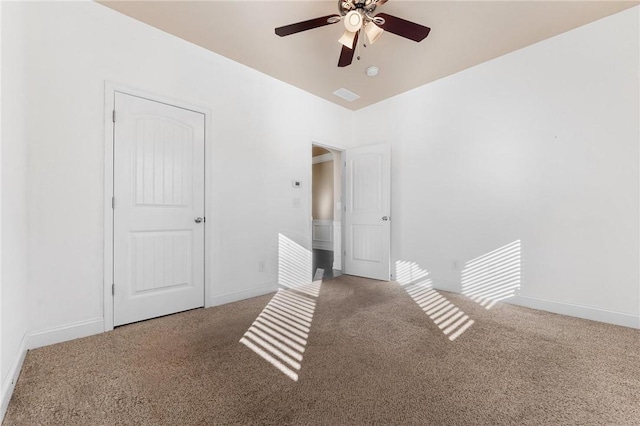 unfurnished room featuring ceiling fan and carpet flooring