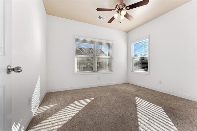 carpeted empty room with ceiling fan