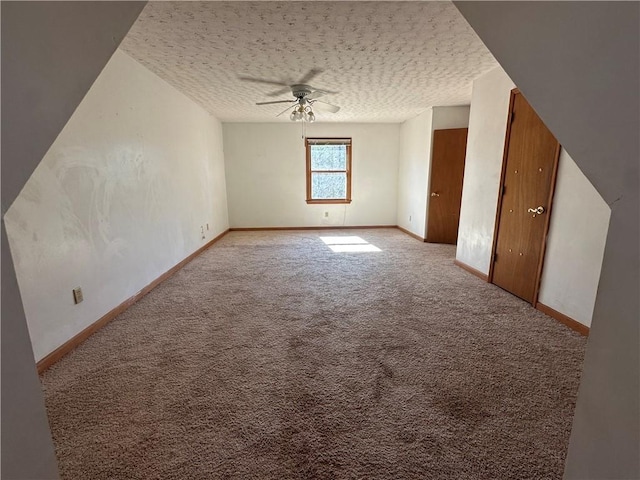 additional living space featuring light carpet, a textured ceiling, and ceiling fan