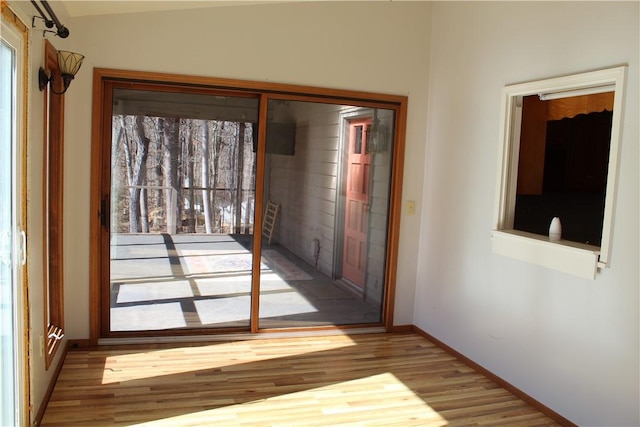 doorway to outside featuring light hardwood / wood-style floors