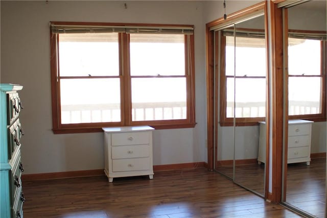 unfurnished bedroom featuring dark hardwood / wood-style flooring