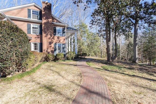 view of home's exterior featuring a yard