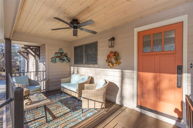 sunroom / solarium with wood ceiling and ceiling fan