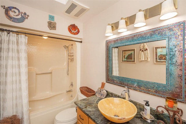 full bathroom with vanity, shower / bathtub combination with curtain, and toilet