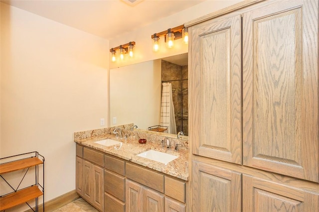 bathroom featuring vanity and curtained shower