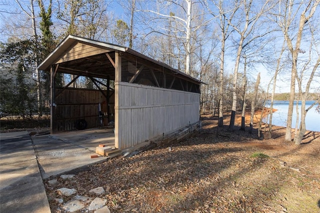 view of outbuilding with a water view