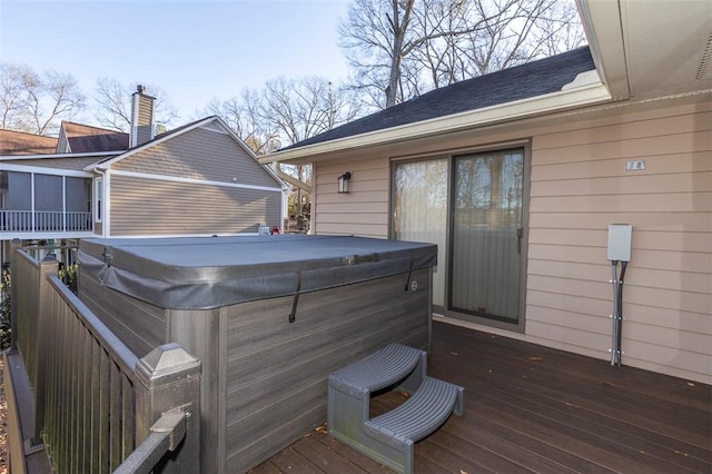 wooden terrace with a hot tub