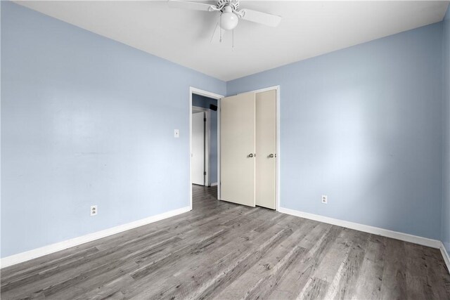 unfurnished room with light hardwood / wood-style flooring and ceiling fan