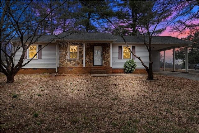 ranch-style house featuring a carport