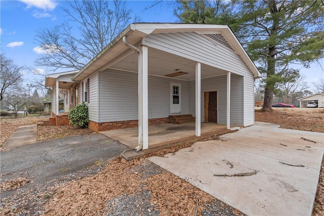 exterior space with a carport