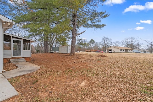 view of yard featuring a sunroom