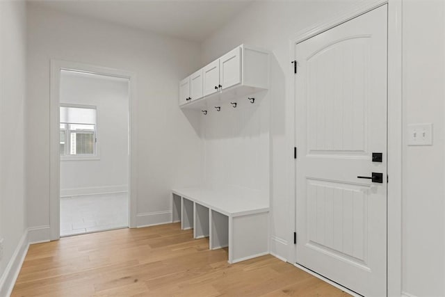 mudroom with light hardwood / wood-style flooring